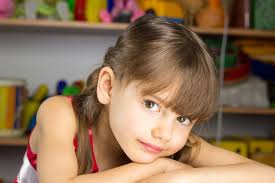 6 years old girl blond hair, red dress with white polka dots Stock ...